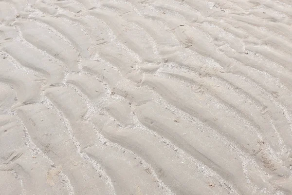 Playa de arena para fondo y textura . —  Fotos de Stock