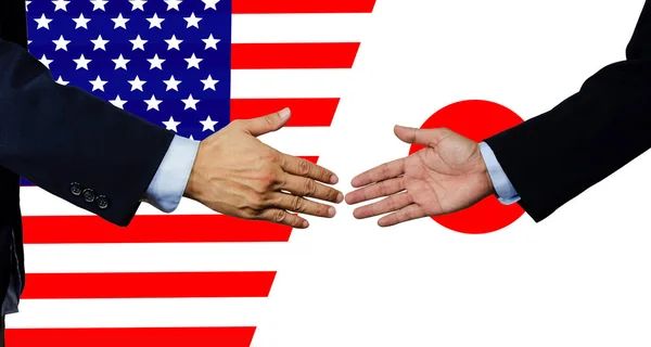 Bir iş adamı, ABD ve Japonya ile tokalaşıyor. — Stok fotoğraf