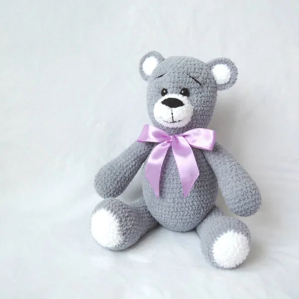 Crocheted big gray teddy bear front view