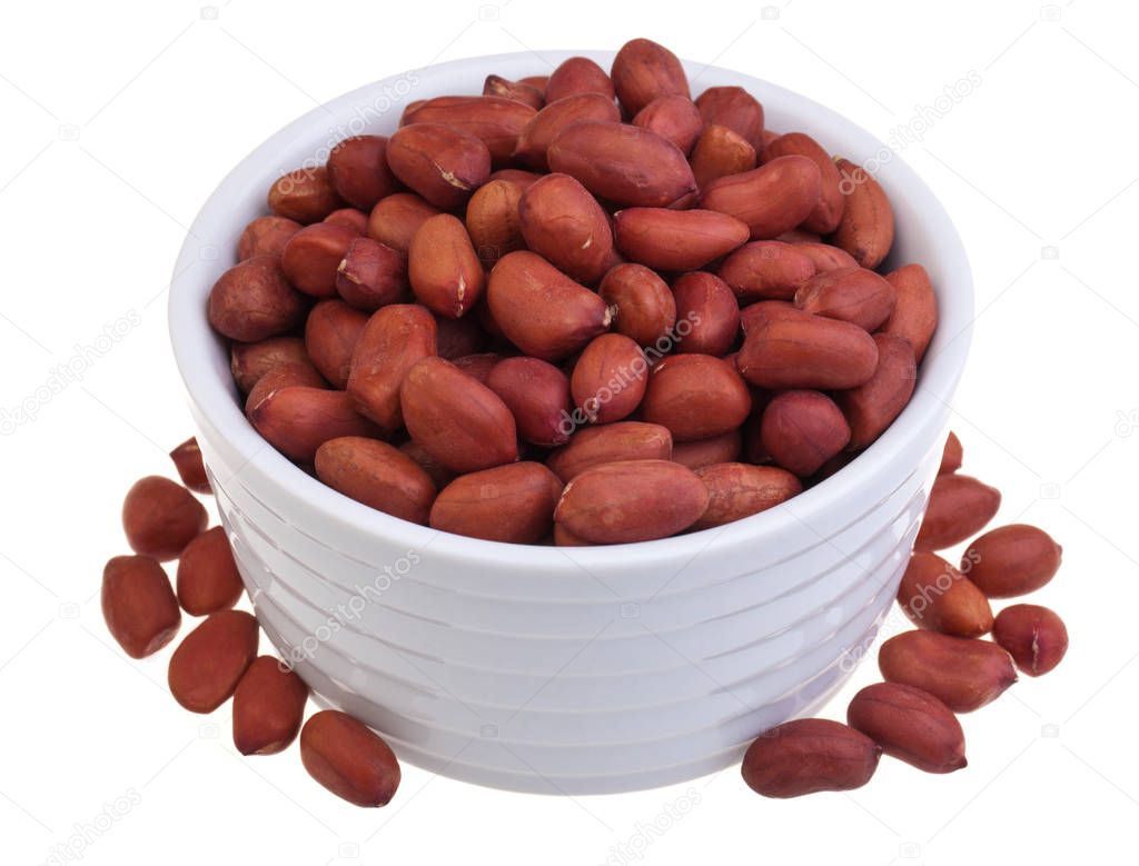 Raw redskin peanuts on white background