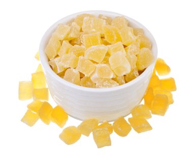Sweet pineapple succade cubes on white background clipart