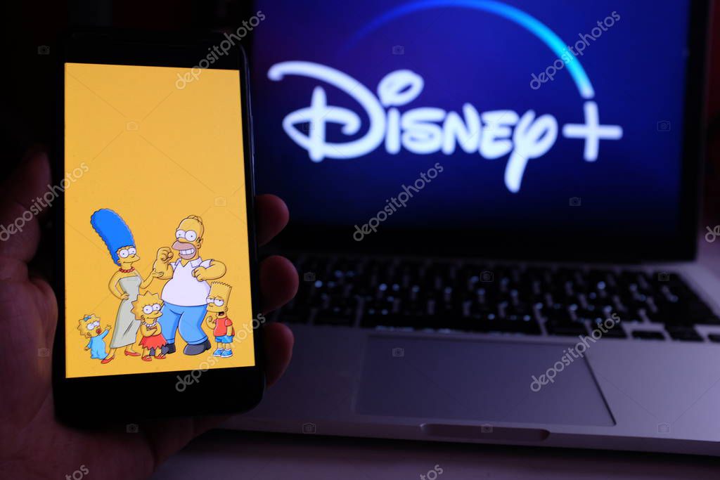 United States, New York. Sunday, September 29, 2019.Iphone 11 with the image of the Simpsons series, in the background the new Disney Plus service. Disney + will be an online video streaming