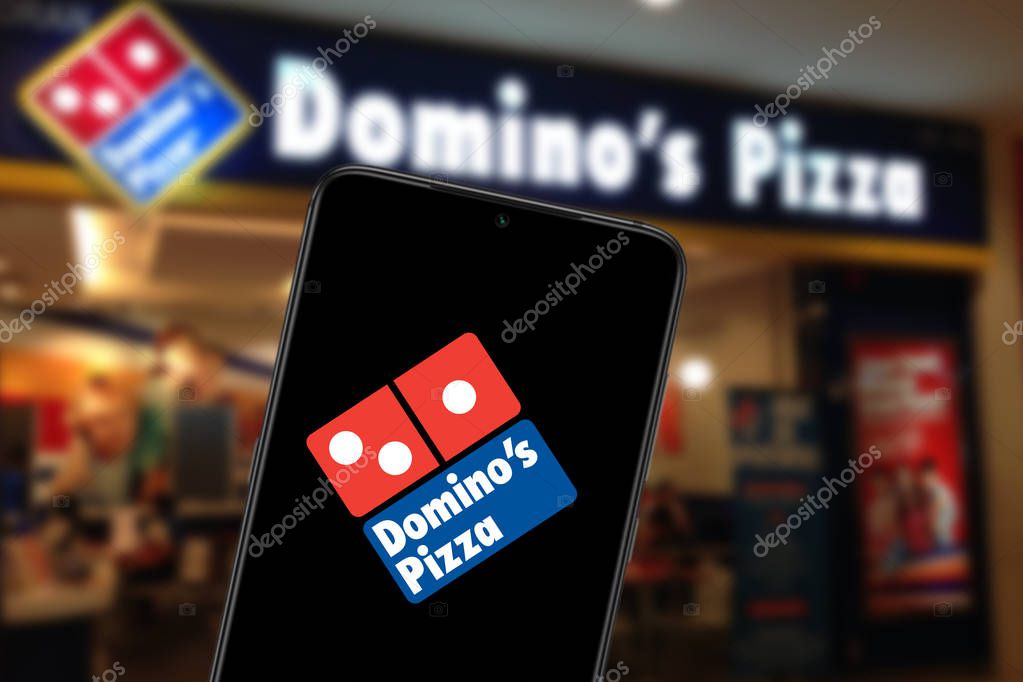 Smart phone with the Domino's Pizza logo is an American fast food restaurant company. United States, California Saturday, January 25, 2020.