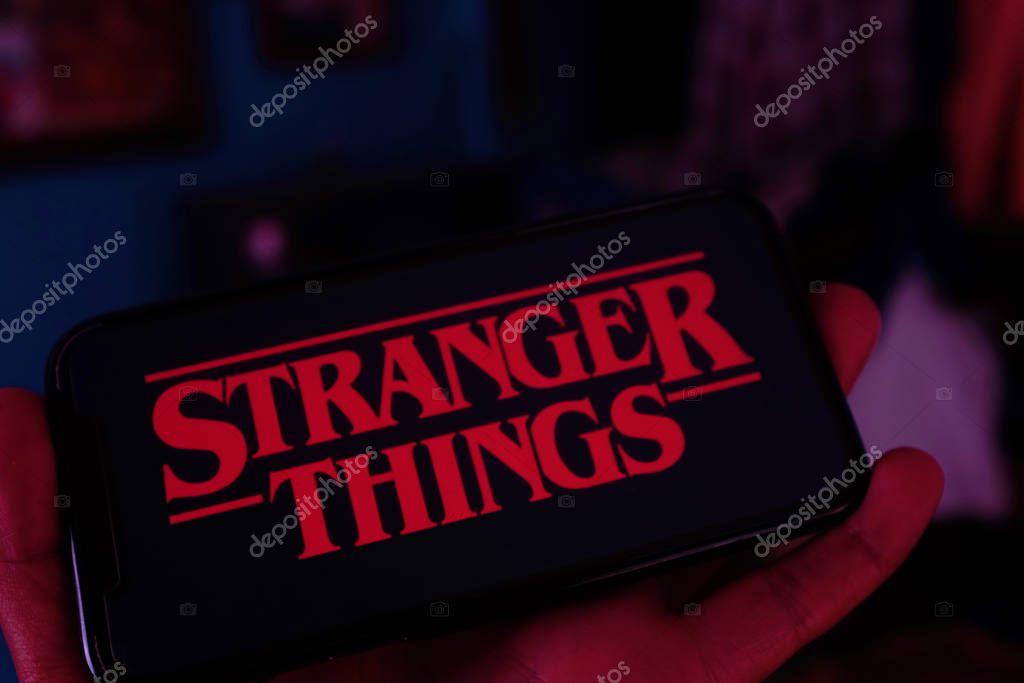 Iphone with the Netflix logo and computer with the Stranger Things logo is a series of suspense and science fiction.Sunday, February 17, 2020, New York, United States.