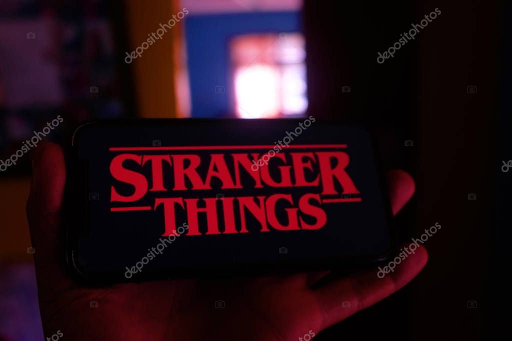 Iphone with the Netflix logo and computer with the Stranger Things logo is a series of suspense and science fiction.Sunday, February 17, 2020, New York, United States.