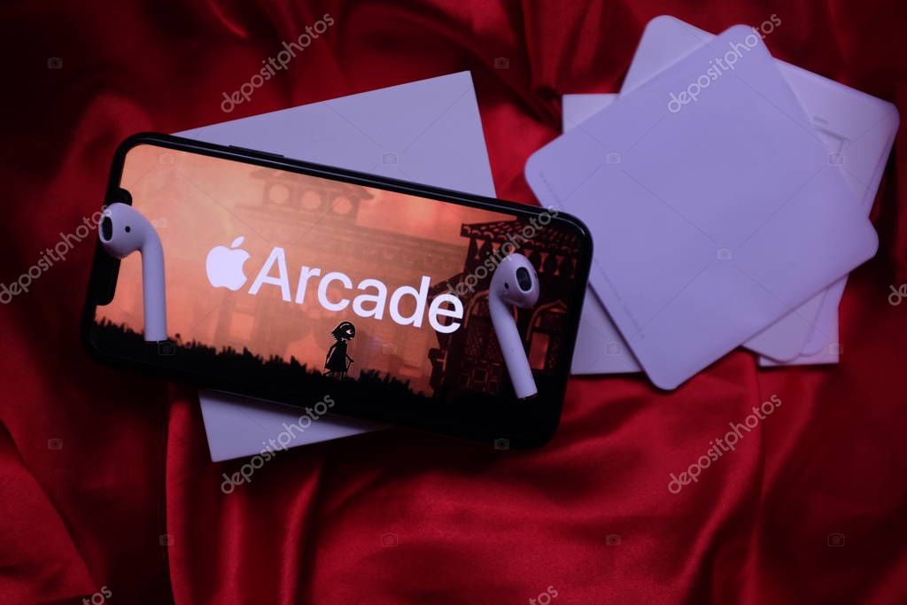 Airpods, Macbook pro and iphone 11 pro with the Apple Arcade logo. Apple Arcade is a video game subscription service. United States, New York, Thursday, October 3, 2020