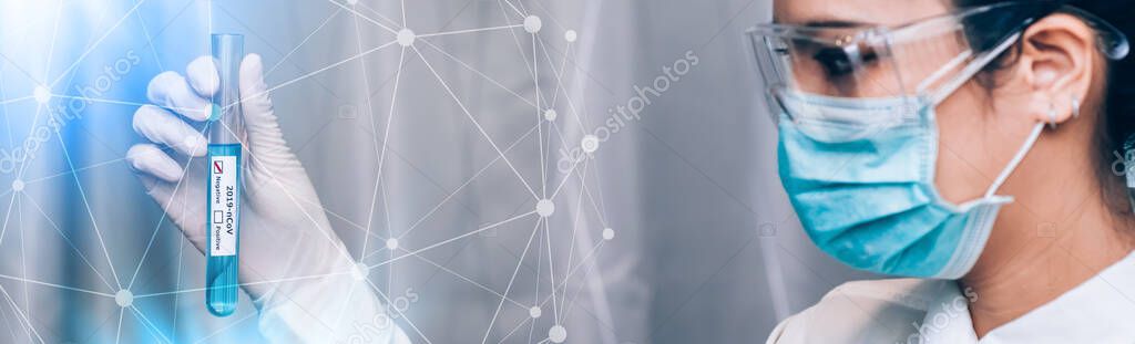 Medical laboratory technologist holding test tube with sampling contaminated with 2019-nCoV or Coronavirus lab test in COVID-19 situation outbreaking - Panoramic Banner