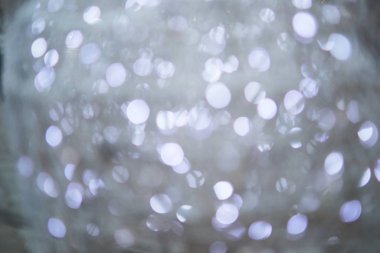 Bulanık ışıkları ve bokeh 'i olan gri şenlikli arka plan