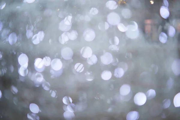 Bulanık ışıkları ve bokeh 'i olan gri şenlikli arka plan