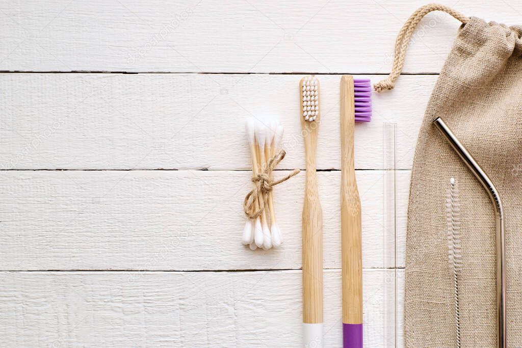 Zero Waste kit for shopping, personal hygiene and kitchen. Flat lay. White wooden background.