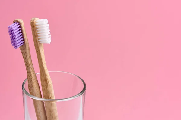 Two Bamboo Toothbrush Close Glass Pink Background Eco Frendly Zero — Stock Photo, Image