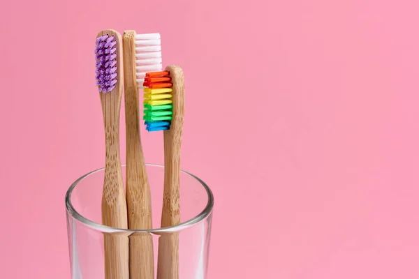 Three Bamboo Toothbrush Close Glass Pink Background Eco Frendly Zero — Stock Photo, Image