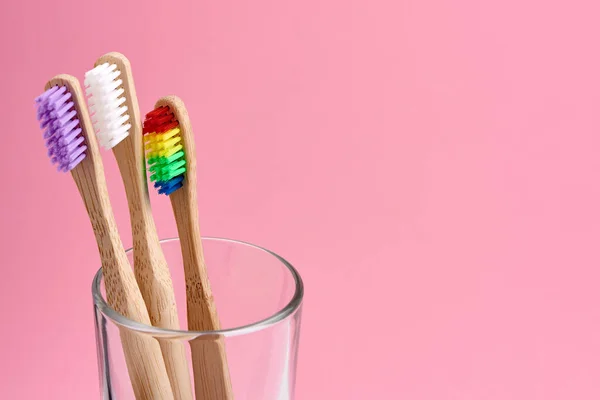 Three Bamboo Toothbrush Close Glass Pink Background Eco Frendly Zero — Stock Photo, Image