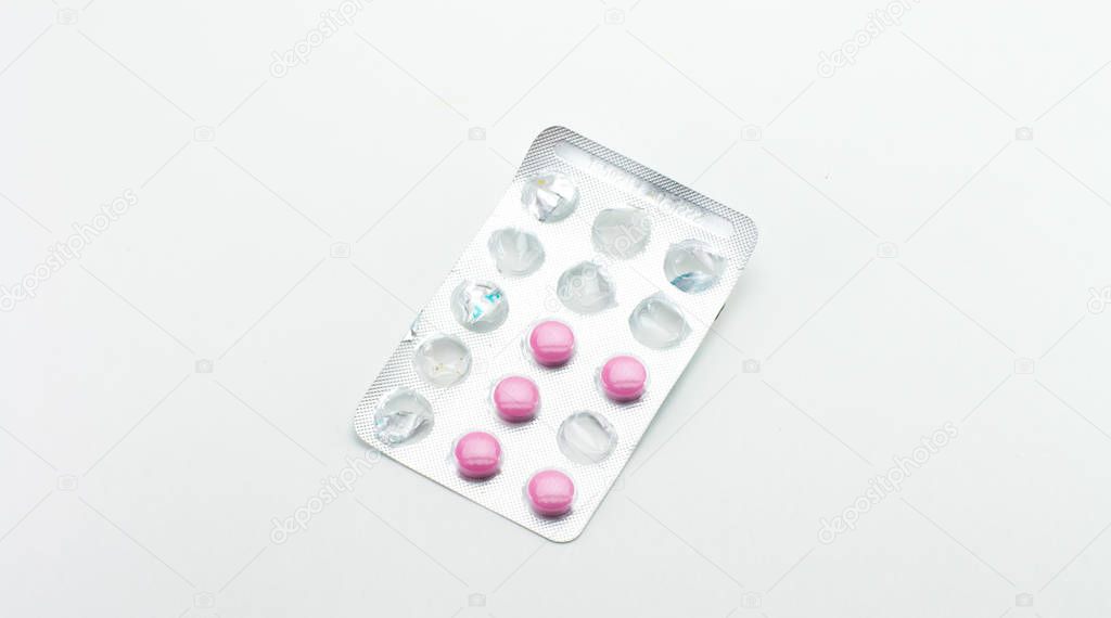 Blister with opened pink tablets.