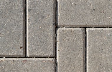 Dikdörtgen gri fayans kaldırımın arka planı. Yakın plan. Beton ve çimentodan 6 döşeme soyutlanmış. Sert kum dokusu..