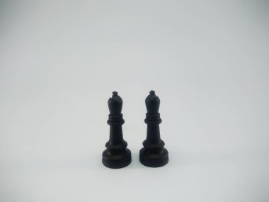 Black plastic pair of bishop chess piece isolated on a white background