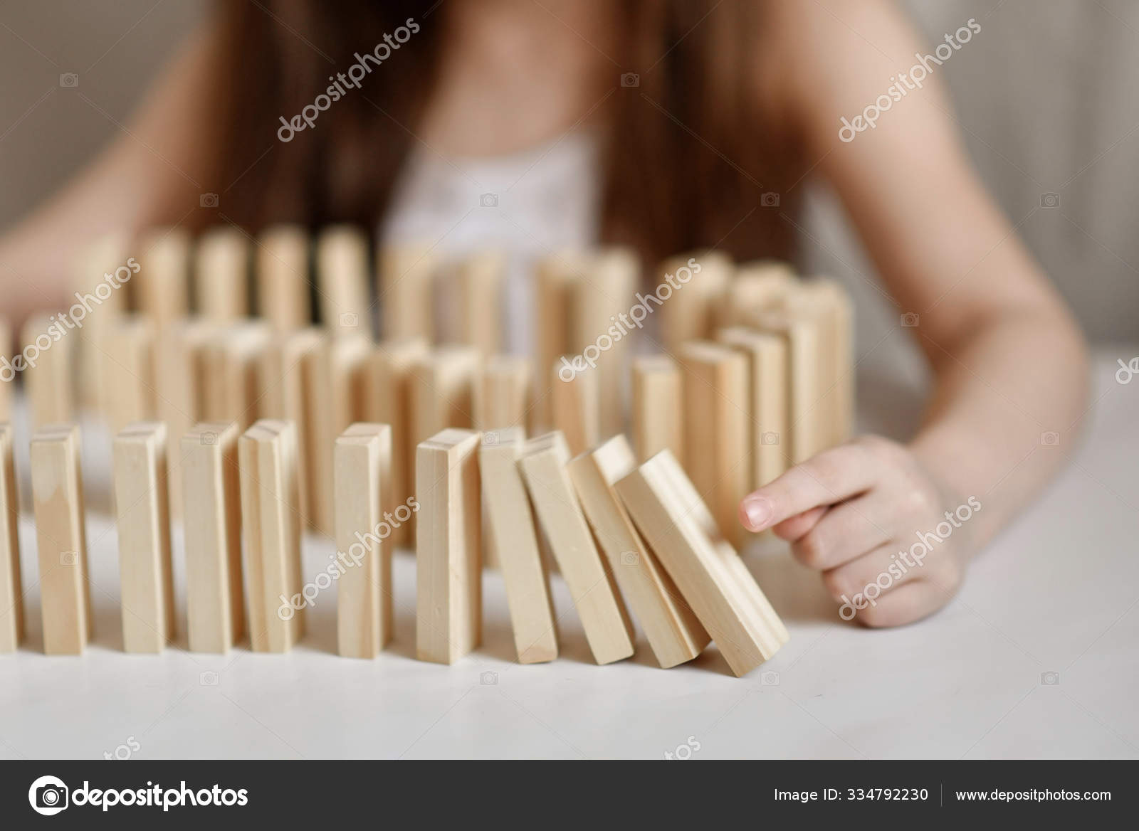 Little Girl Plays Jenga White Clothes Light Background Stock Photo by