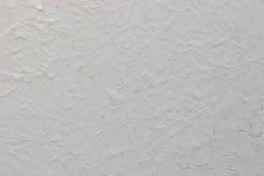 Beton duvardaki eski beyaz çatlak boya. Doku, desen, 
