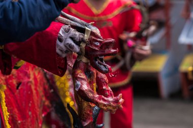 PILLARO, ECUADOR - JANUARY 3, 2020: Person in a red devil mask at the Diablada or Devil Festival
