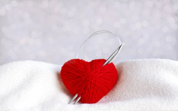 Knitting yarn heart and needles