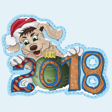 Küçük bir köpek yavrusu bir yeni yıl Tarih 2018 tutuyor