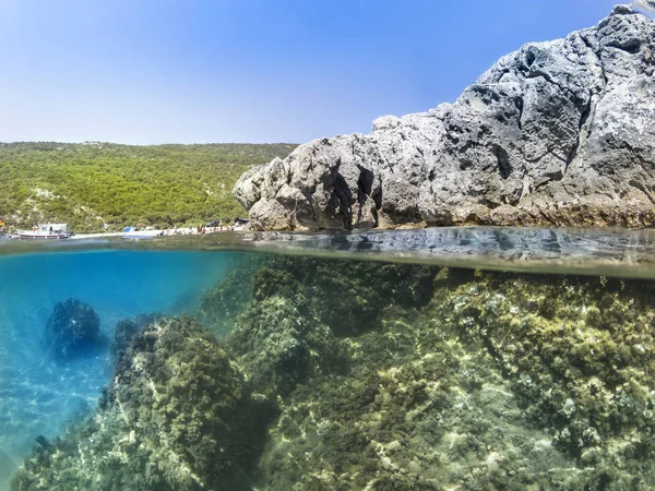 Half underwater and rocks