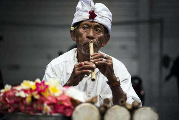 Balinese street musician man. Stock Image