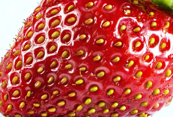 Strawberry texture extreme close up photo.