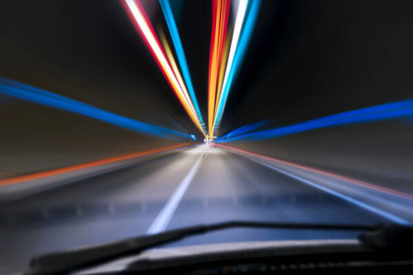 Speeding in a tunnel from view of a drivers angle.