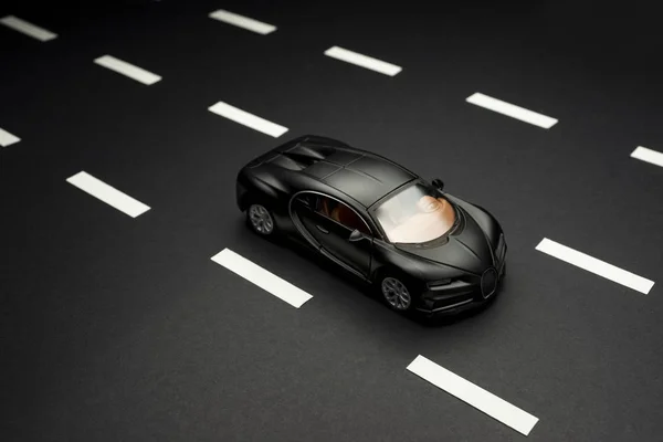 Top view of a Black colored Bugatti Veyron toy car. Stock Image