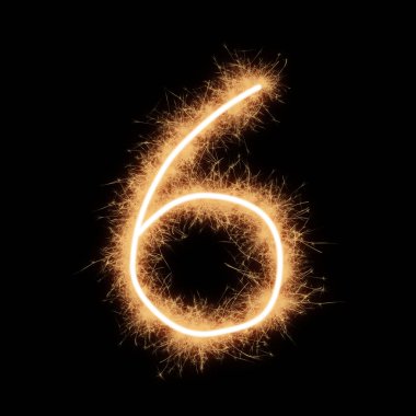 Siyah arkaplanda kıvılcımlar oluşturan altı numaralı sembol..