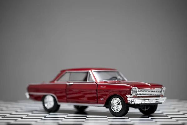Side view of a red colored 1960 Chevrolet Nova toy model car. — 스톡 사진