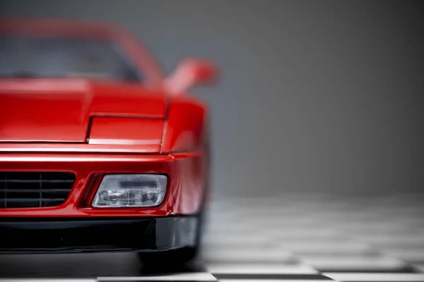 Red toy Ferrari 348TB sports car close up product shot on a cheq — 스톡 사진