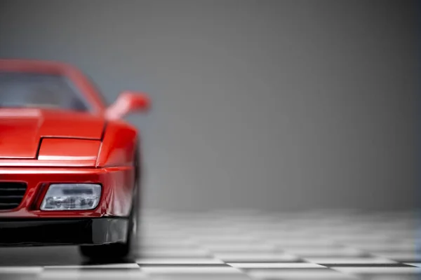 Red toy Ferrari 348TB sports car close up product shot on a cheq — 스톡 사진