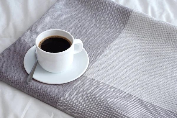 coffee on the duvet cover. Interior. Minimalism. Coziness. Beautiful background