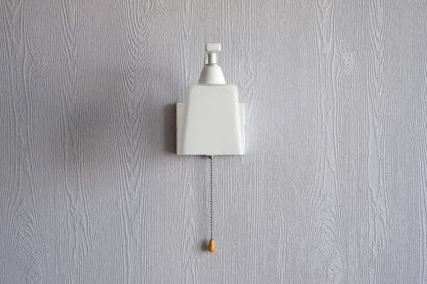 white lamp on a blue wall. Interior. Minimalism