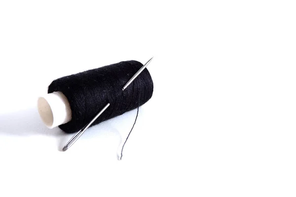 Spool Of Black Thread On White Shirt With Needle, Needle Is Threaded Stock  Photo, Picture and Royalty Free Image. Image 2192890.