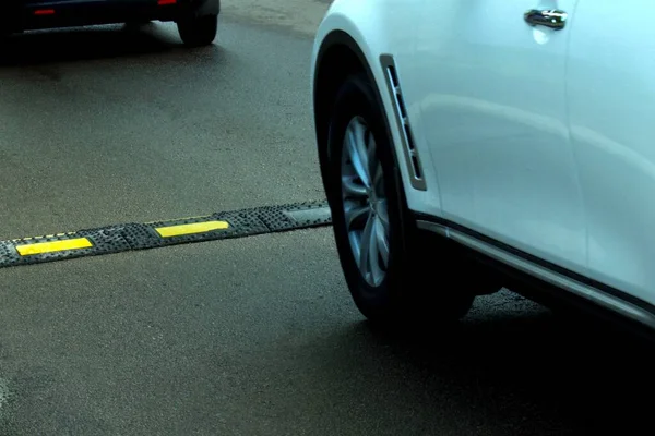 speed bump on road before the car