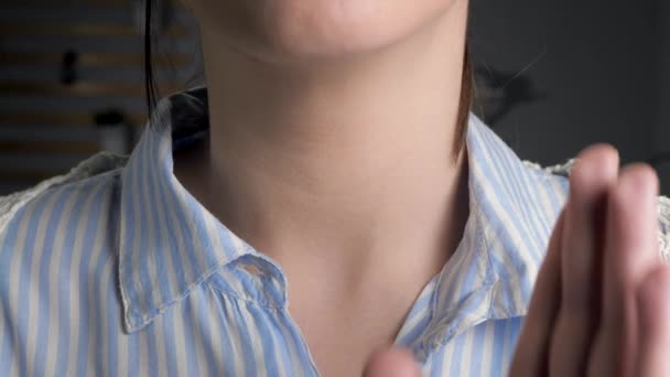 Woman touches her throat her hand and swallows. Sore throat, tonsillitis, laryngitis, pharyngitis, enterovirus infection, mononucleosis, adenovirus infection, allergy concepts. Front view. Close-up — Stock Video
