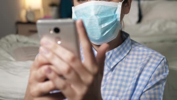 Girl Surgical Mask Looks Phone She Sees News She Happy — Stock Video