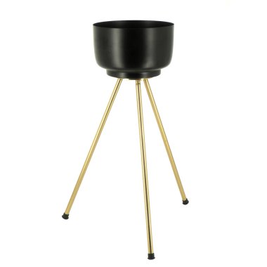 Üç altın bacaklı siyah metal saksı.