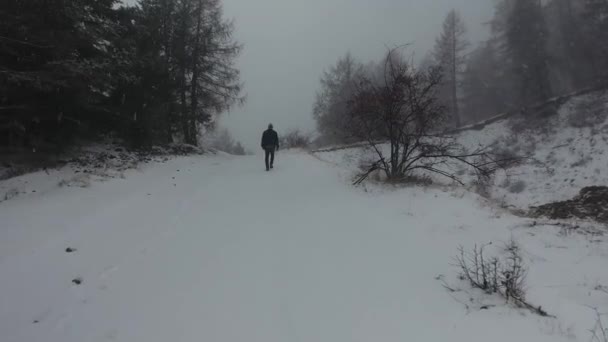 Drone Shot Man Walking Snow — Stock Video