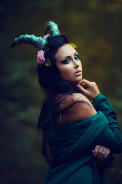 Brunette girl with horns — Stock Photo, Image