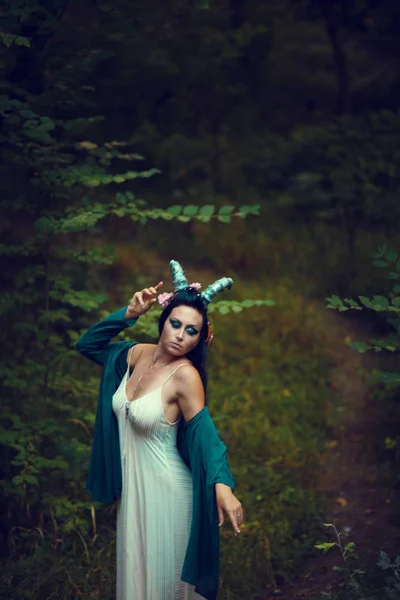 Brunette girl with horns — Stock Photo, Image