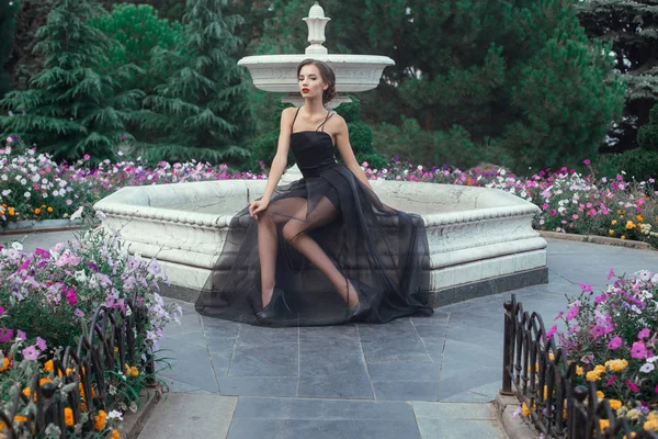 Woman posing in black dress — Stock Photo, Image