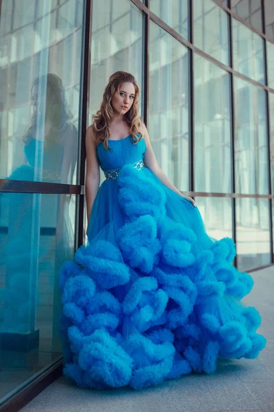 Girl standing in blue dress — Stock Photo, Image