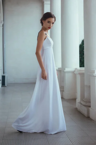 Woman posing in long dress — Stock Photo, Image