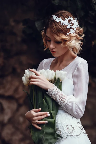 Girl holding white tulips — Stock Photo, Image