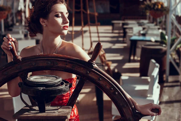 brunette girl posing in red dress