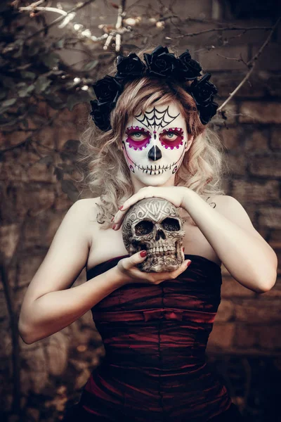 young woman with skull makeup